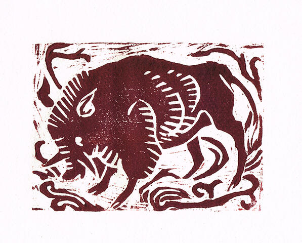 boar woodcut of a boar, with vines around the edges of the block.